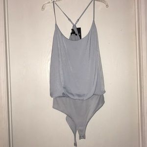 Baby blue body suit.